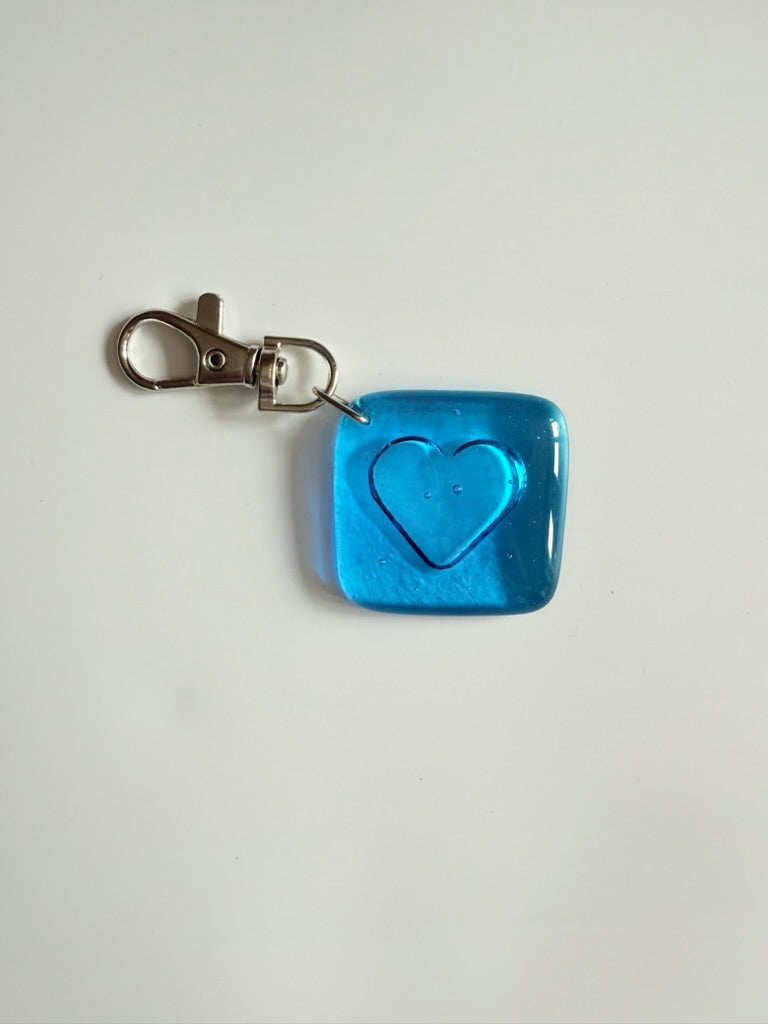 Blue square keychain with heart design
