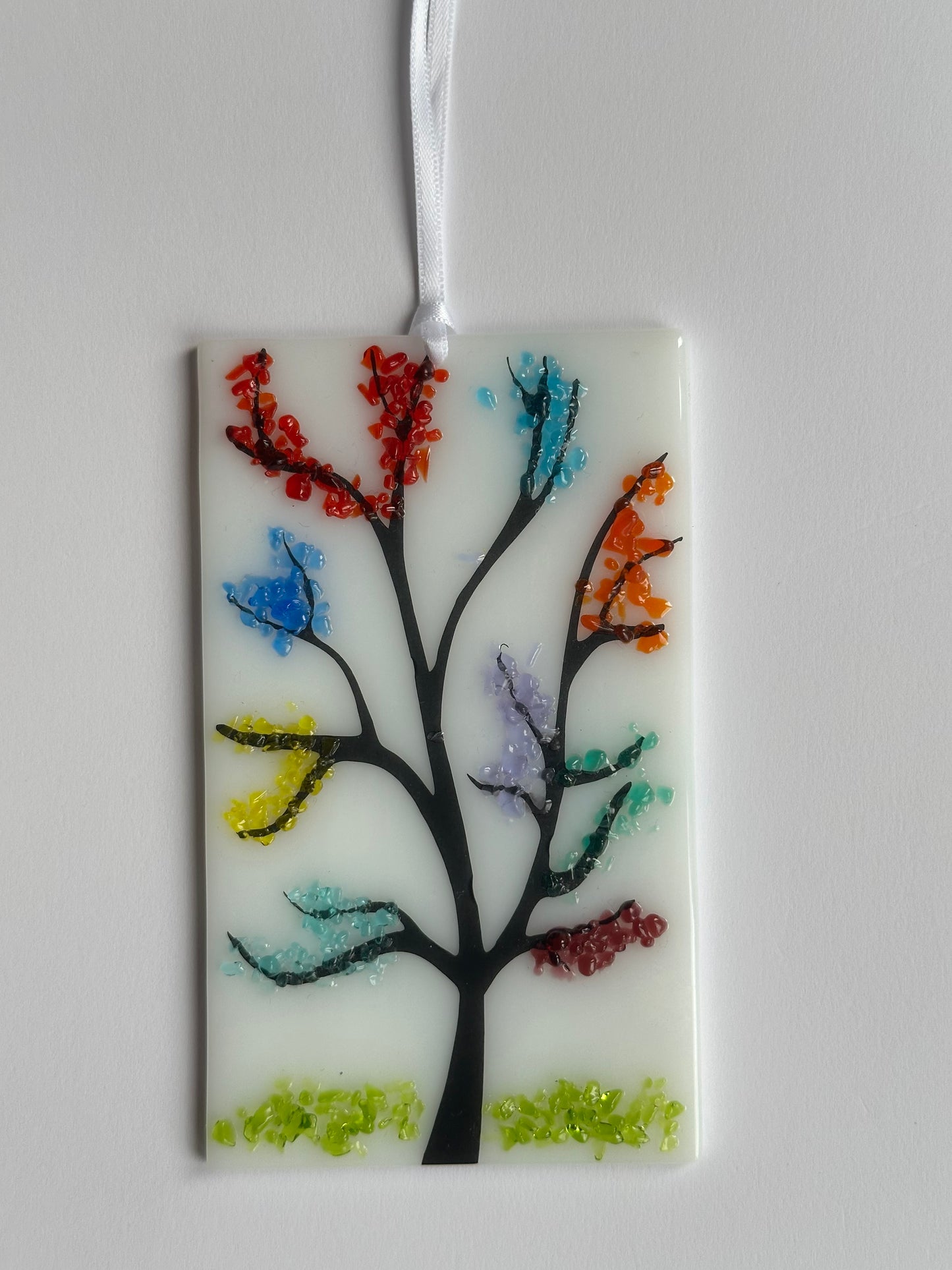 Colourful Tree effect hanging decoration on white.