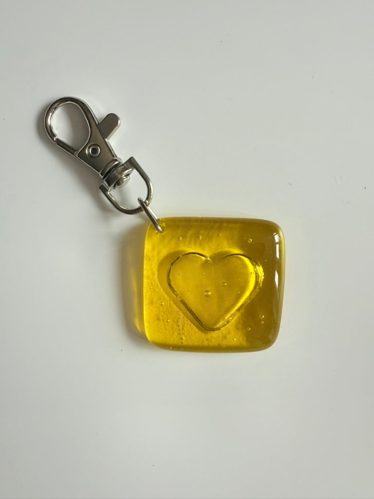 Yellow square keychain with heart design 