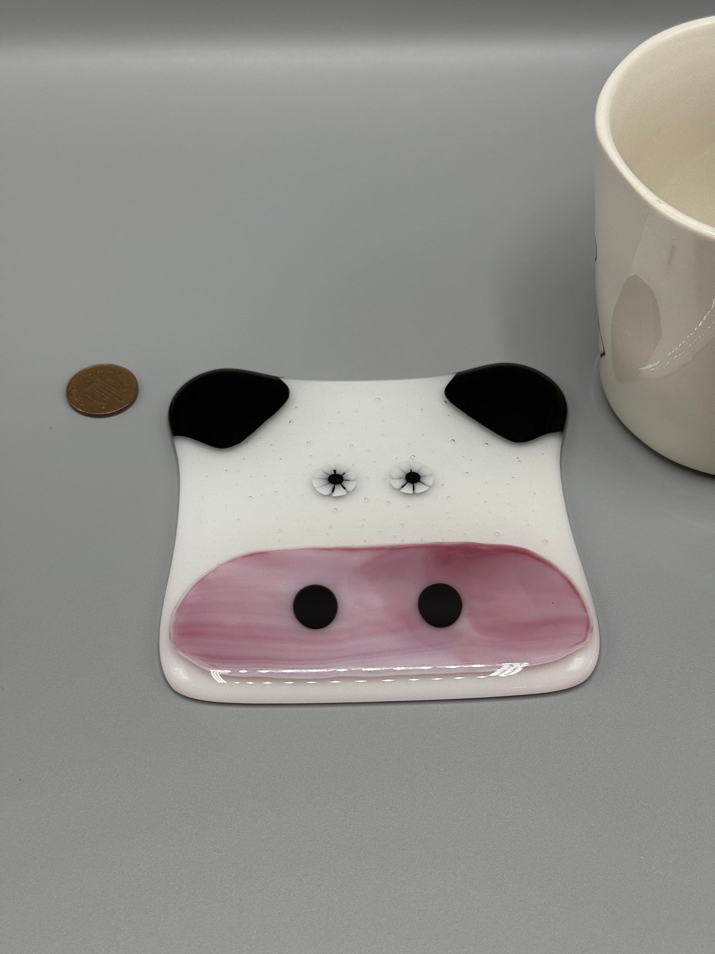 Cow-shaped object on a gray background
