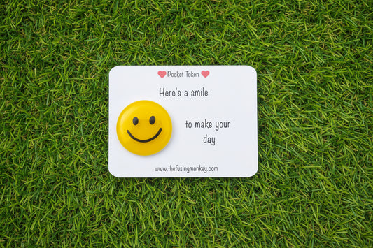 Here's a smile to make your day glass token